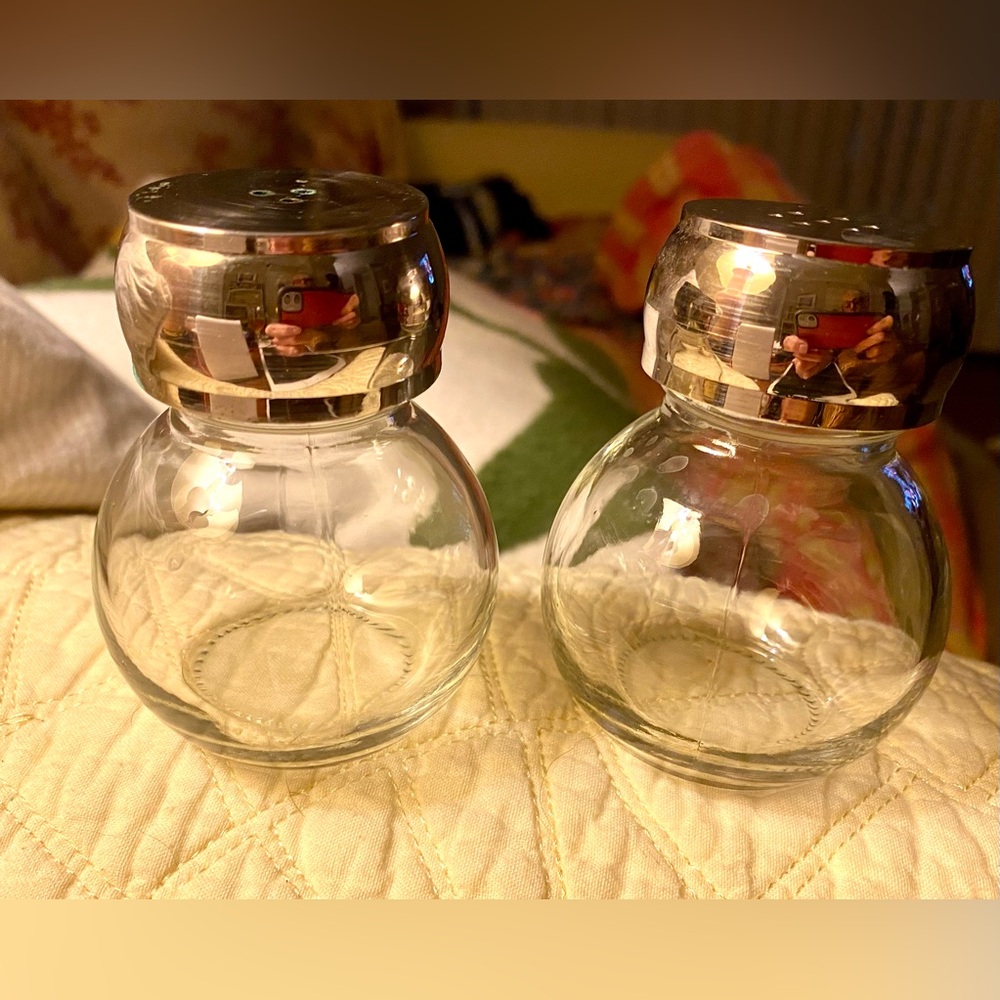 Vintage Salt & Pepper Shakers made of clear heavy glass and chrome shiny tops.